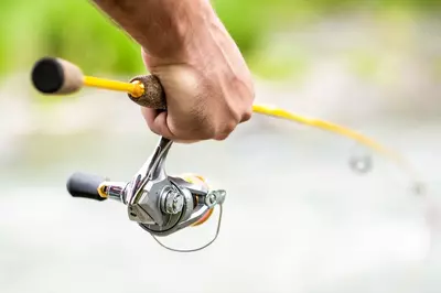 man holding fishing pole